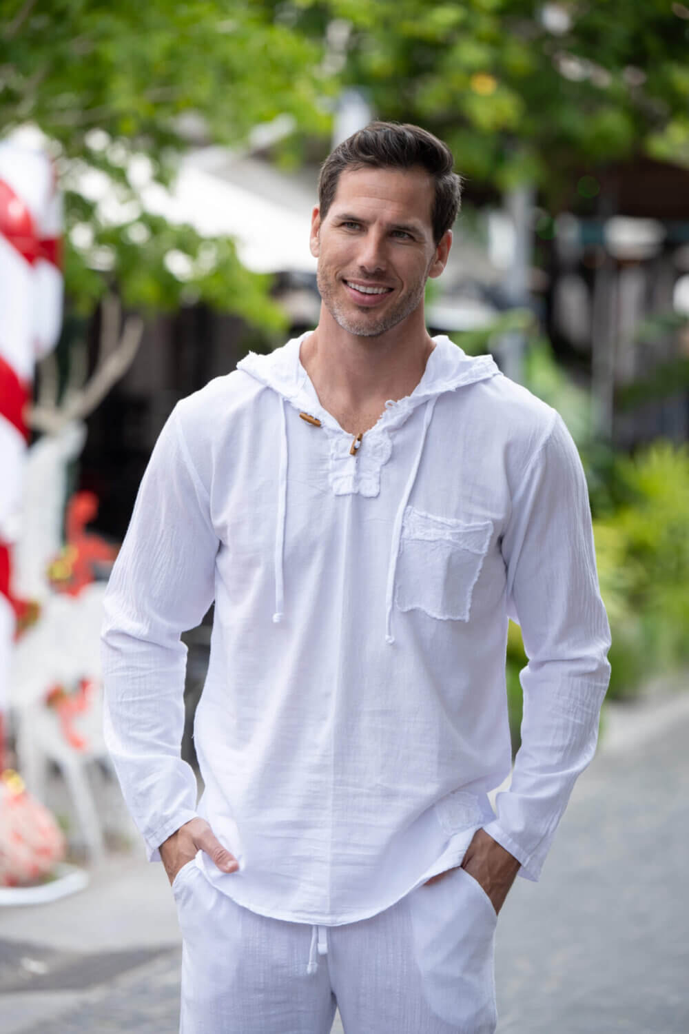 Man in long sleeve white hoodie with drawstrings