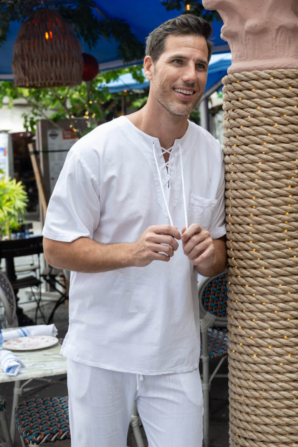 Man in white shirt with drawstrings