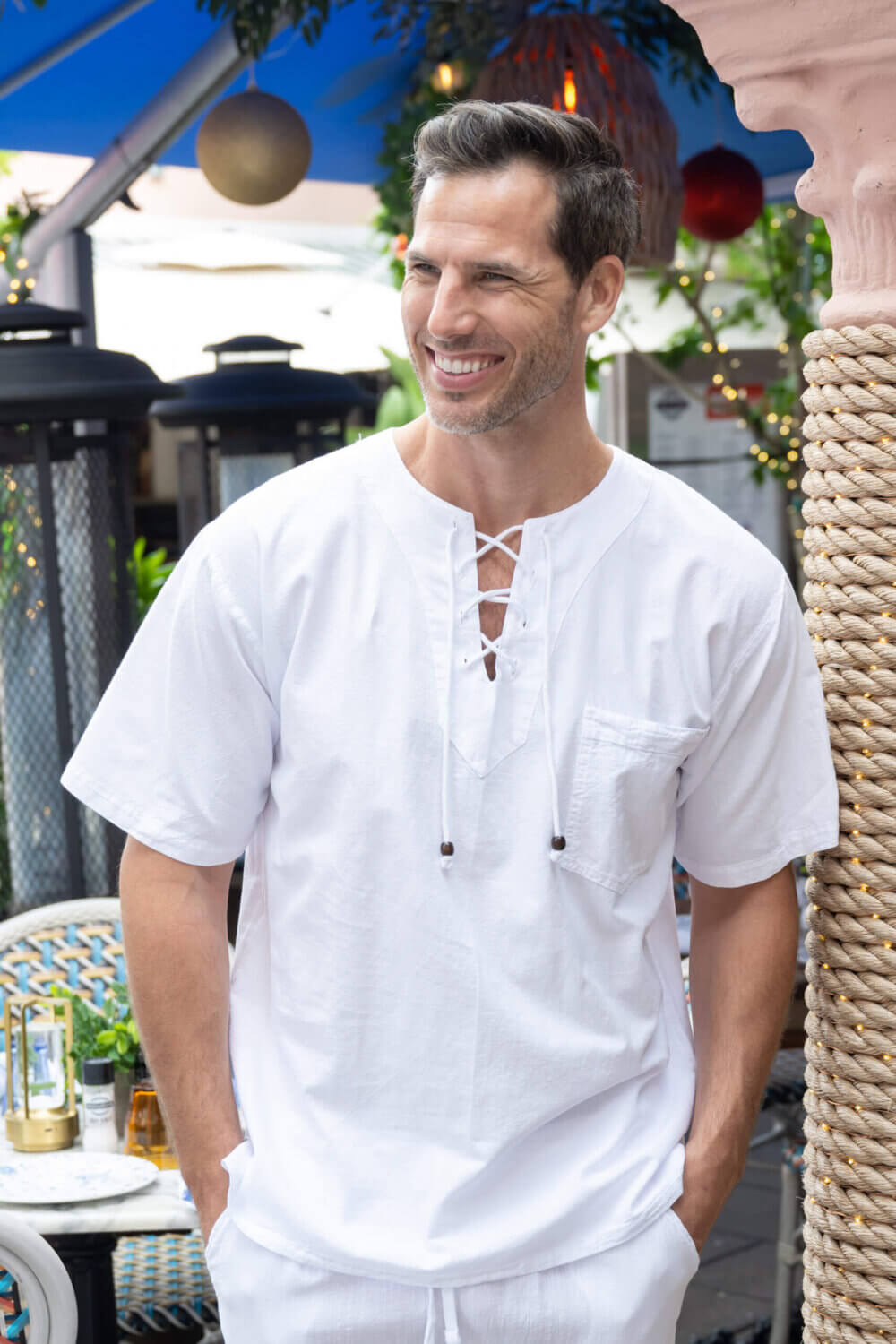 Man in white shirt with drawstrings