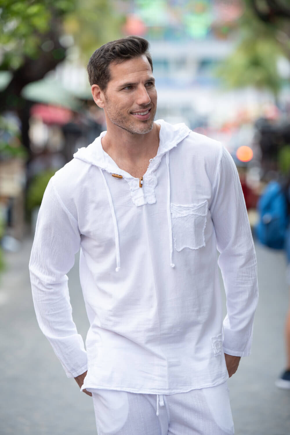 Man in long sleeve white hoodie with drawstrings